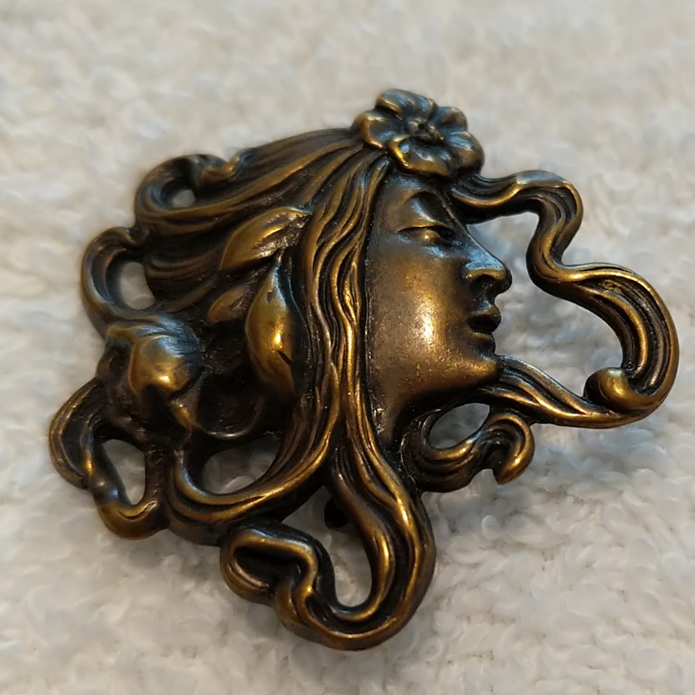 Pin of woman with flower in her hair